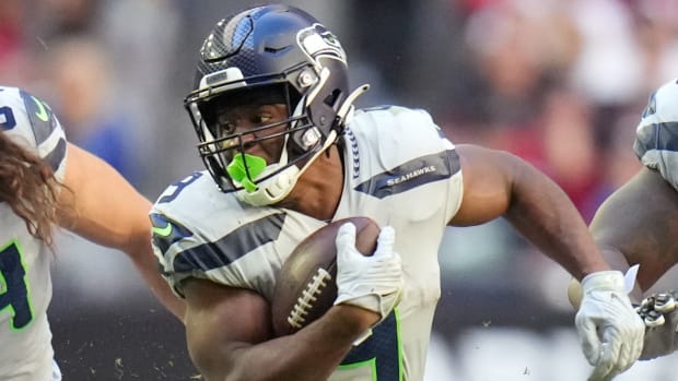 Seattle Seahawks running back Kenneth Walker III runs the ball against the Arizona Cardinals at State Farm Stadium.